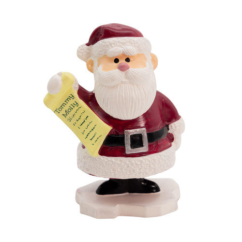 Rudolph the Red Nosed Reindeer TV show character Santa Claus figurine holding a yellow list 