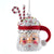 Decorative Christmas ornament shaped like a Santa Claus mug with candy canes on a tree by Kurt Adler Christmas Cheer All Year