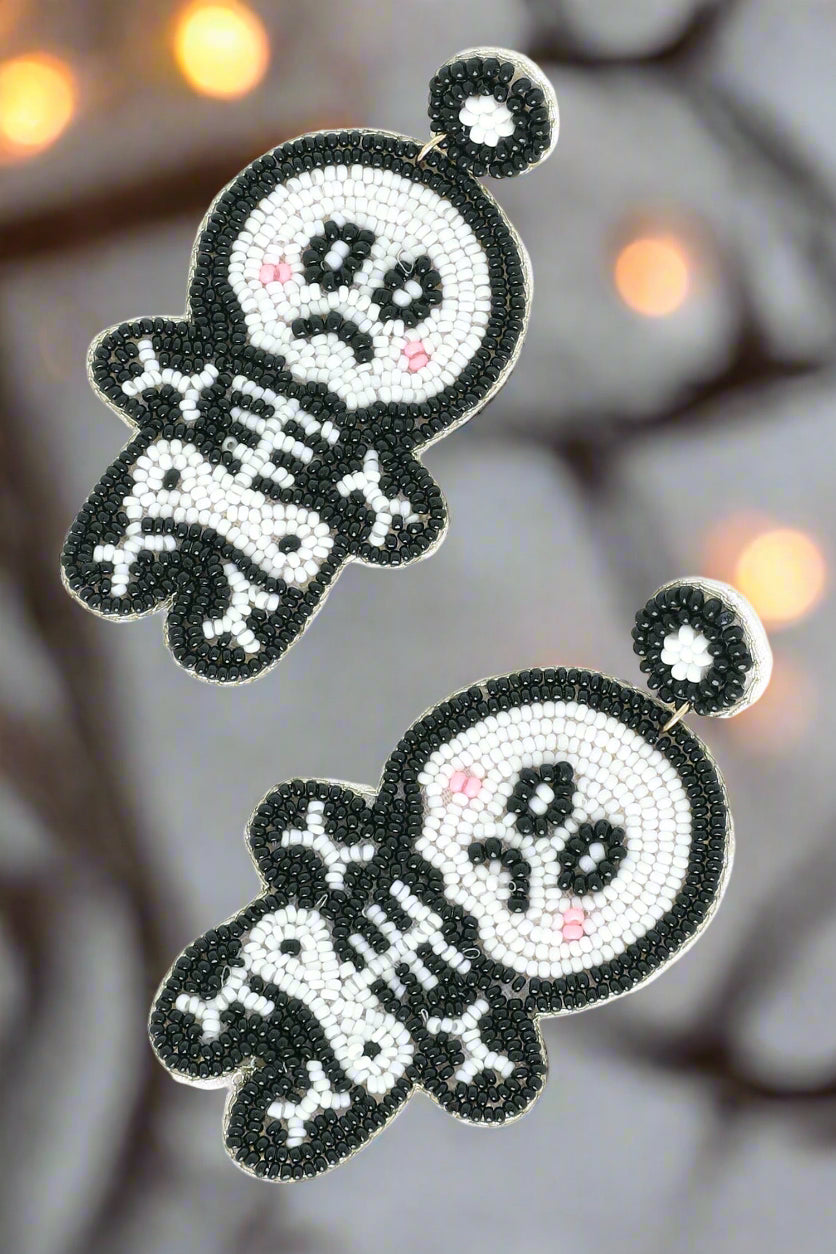 Pair of beaded earrings shaped like skeletons for Halloween Christmas Cheer All Year