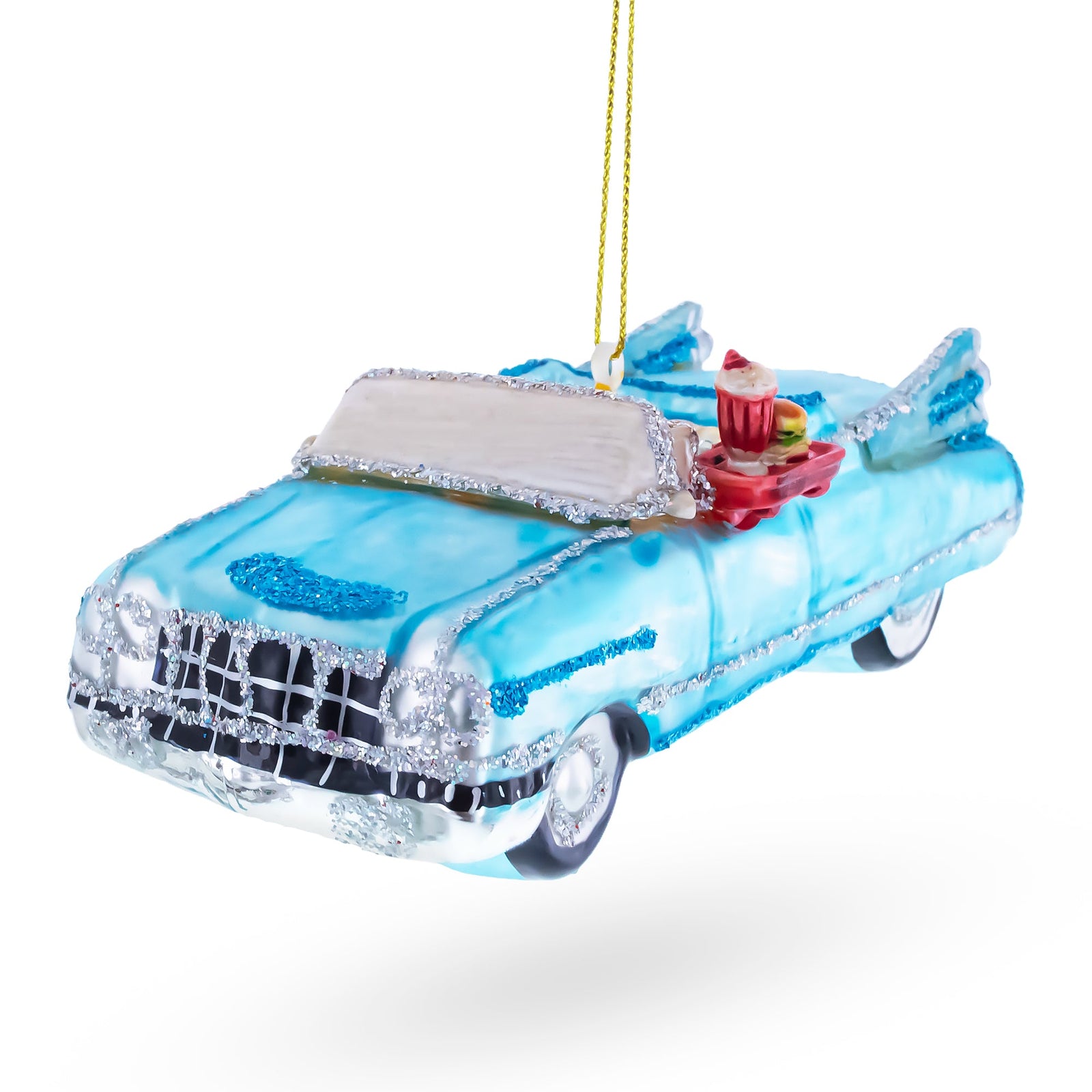 Vintage 1959 blue cadillac with rocket ship fins ornament