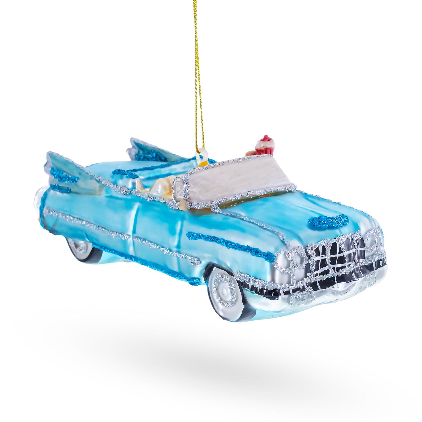 Vintage 1959 blue cadillac with rocket ship fins ornament