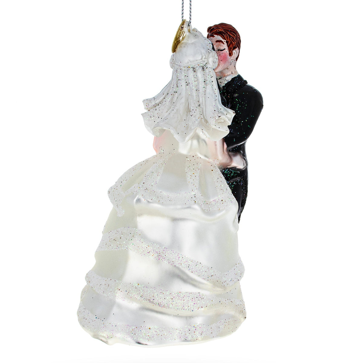 Decorative ornament of a bride and groom in wedding attire on a white background