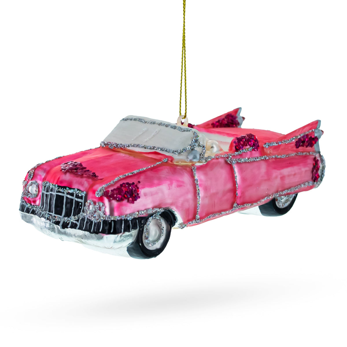 1959 Pink cadillac car ornament with decorative elements on a white background