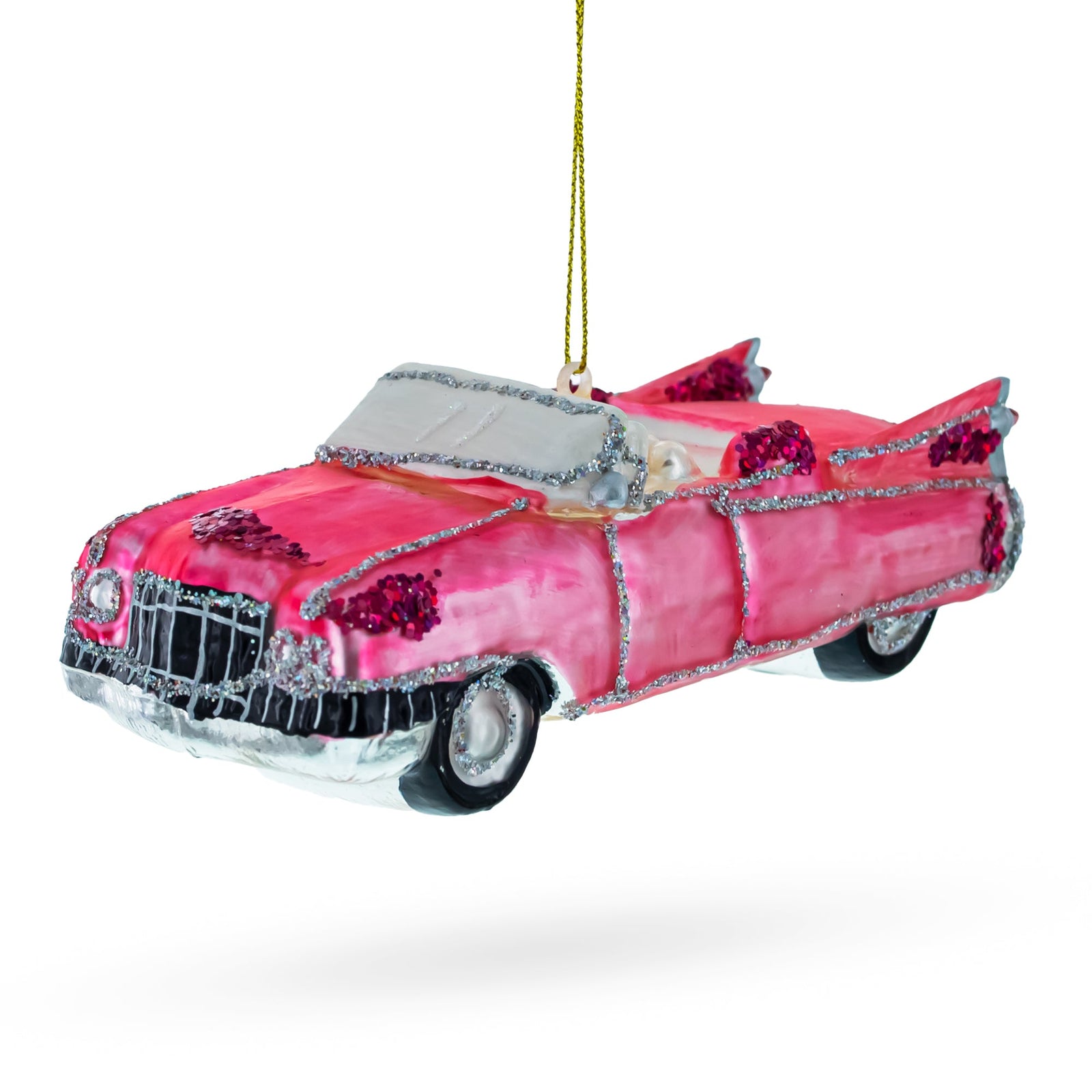 1959 Pink cadillac car ornament with decorative elements on a white background