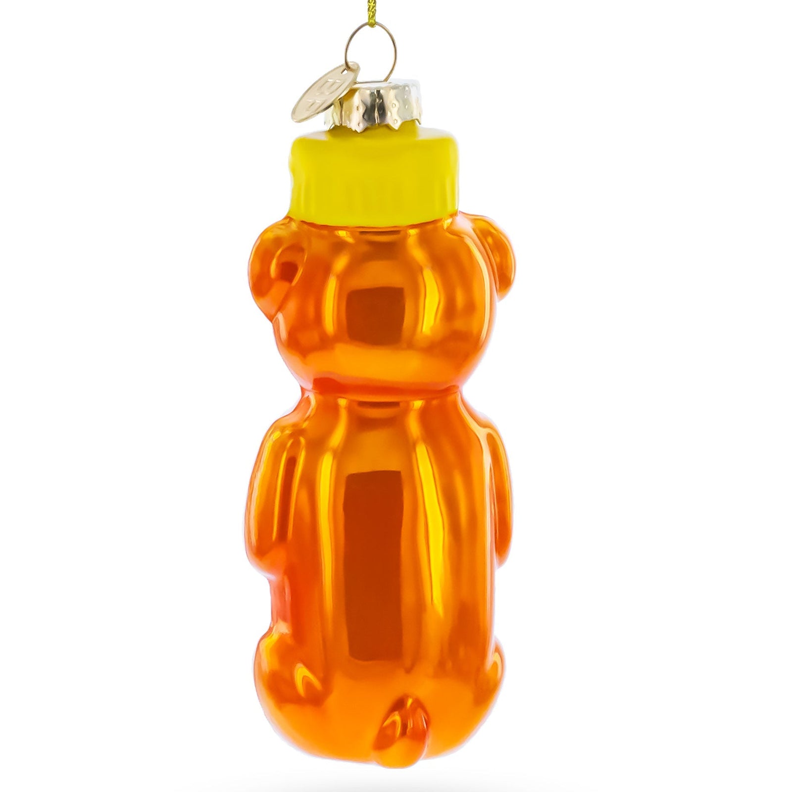 Orange bear-shaped glass ornament with a yellow top on a white background