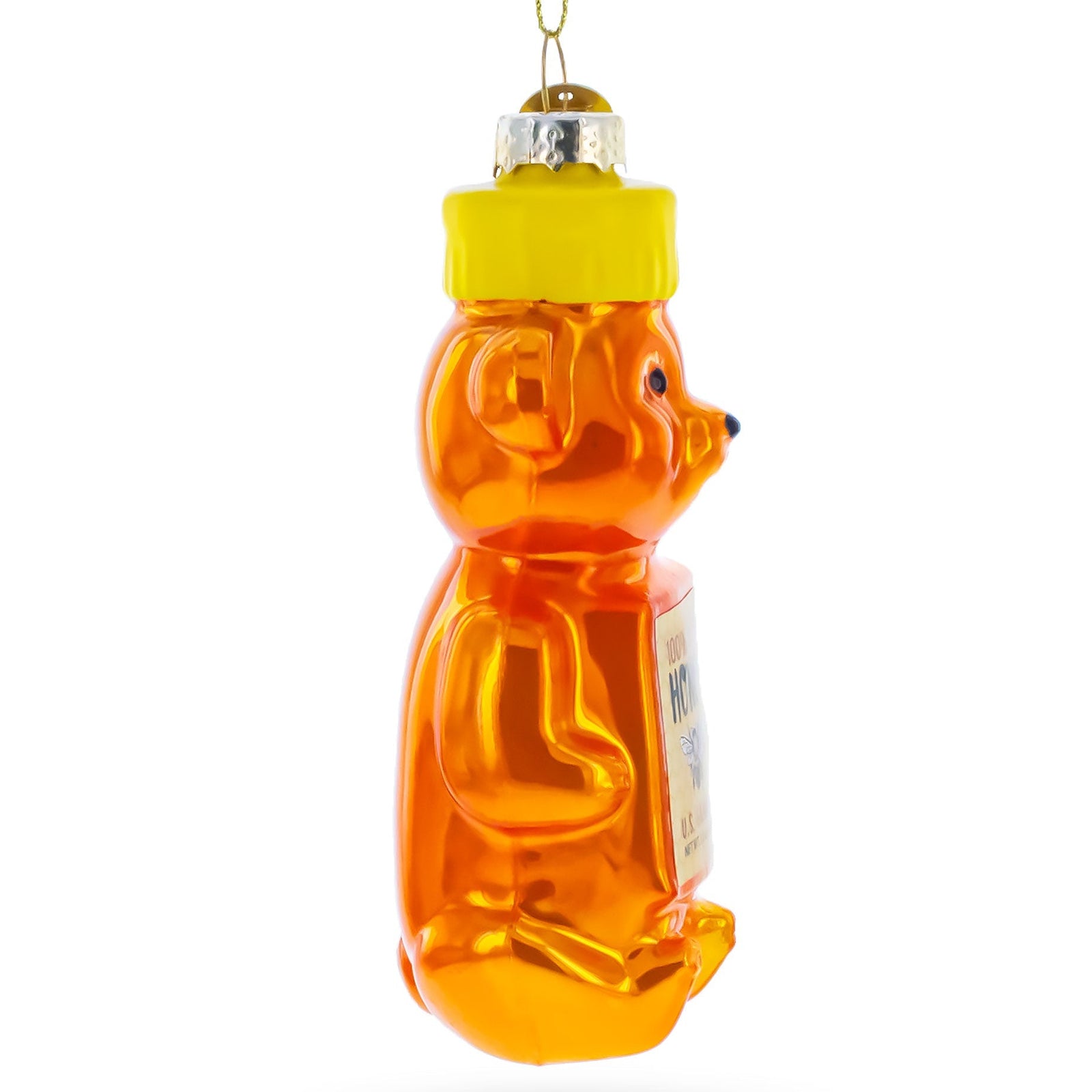 Honey bear ornament with a yellow cap on a white background