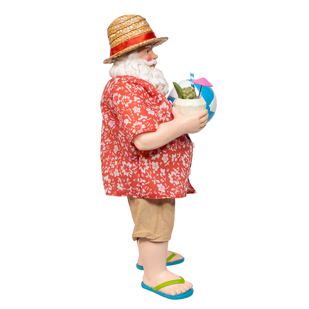 Christmas Cheer All Year Santa Claus figure in beach attire holding a drink, beach ball, and 'VACAY' bag on a white background