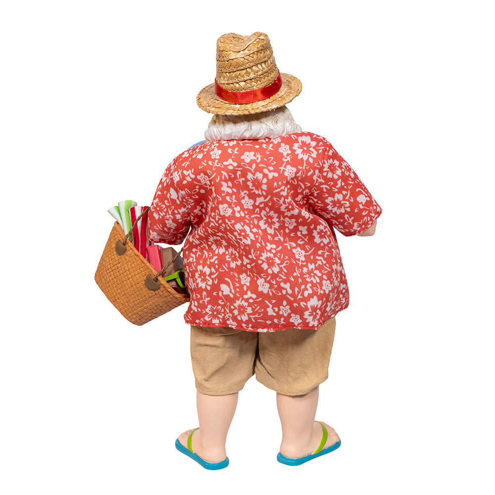 Christmas Cheer All Year Santa Claus figure in beach attire holding a drink, beach ball, and 'VACAY' bag on a white background