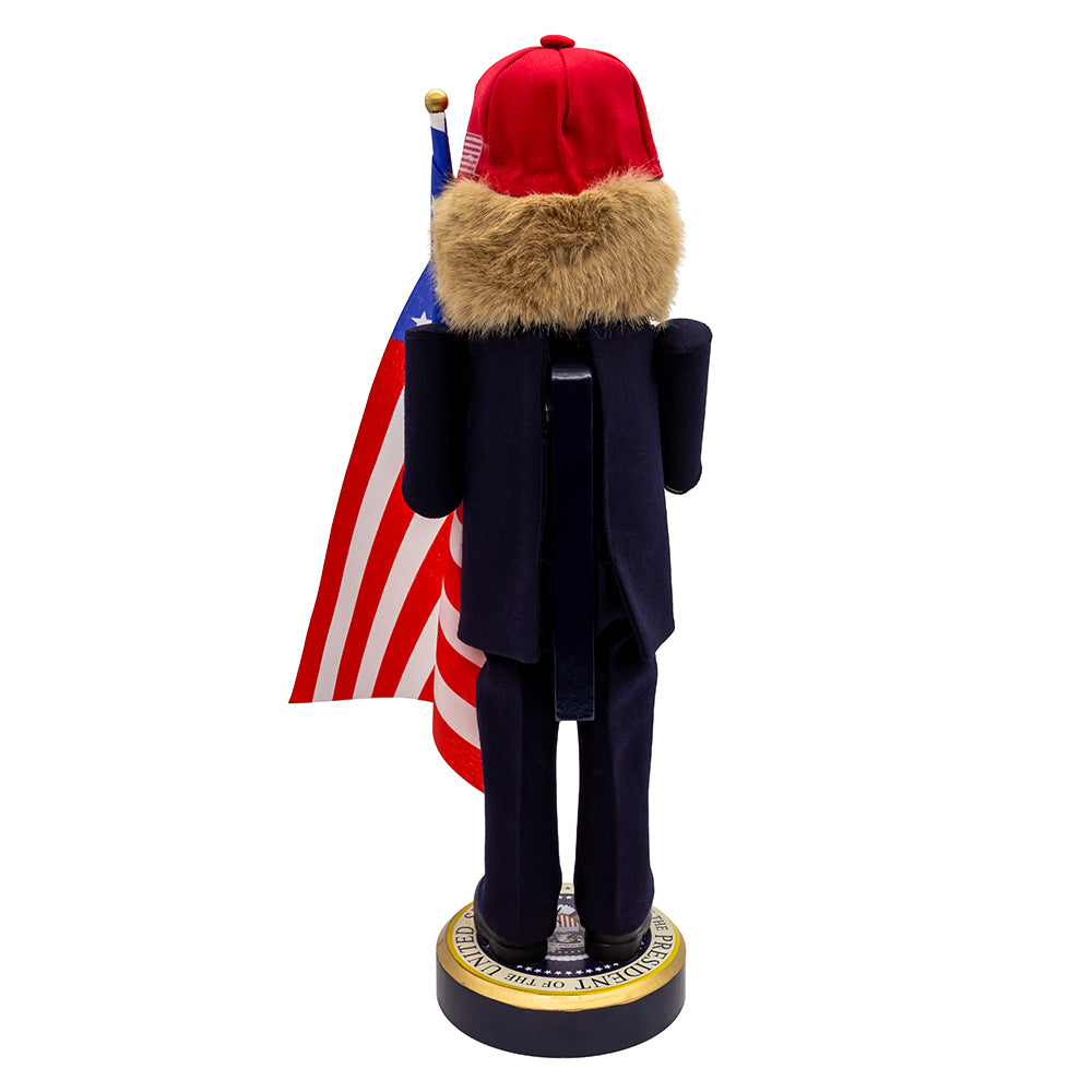 Christmas Cheer All Year Donald J. Trump Presidential Nutcracker Make America Great Again Red Baseball Cap Navy Suit American Flag on Pedestal by Kurt Adler G5013