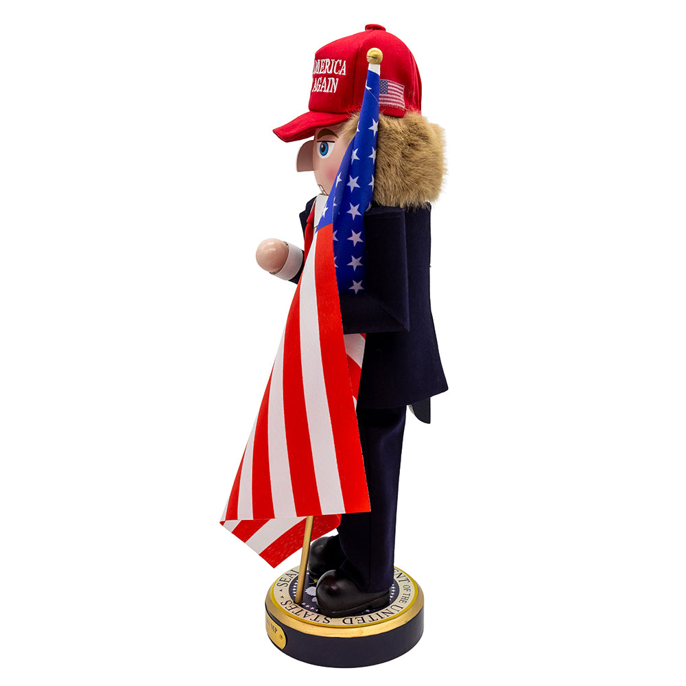 Christmas Cheer All Year Donald J. Trump Presidential Nutcracker Make America Great Again Red Baseball Cap Navy Suit American Flag on Pedestal by Kurt Adler G5013