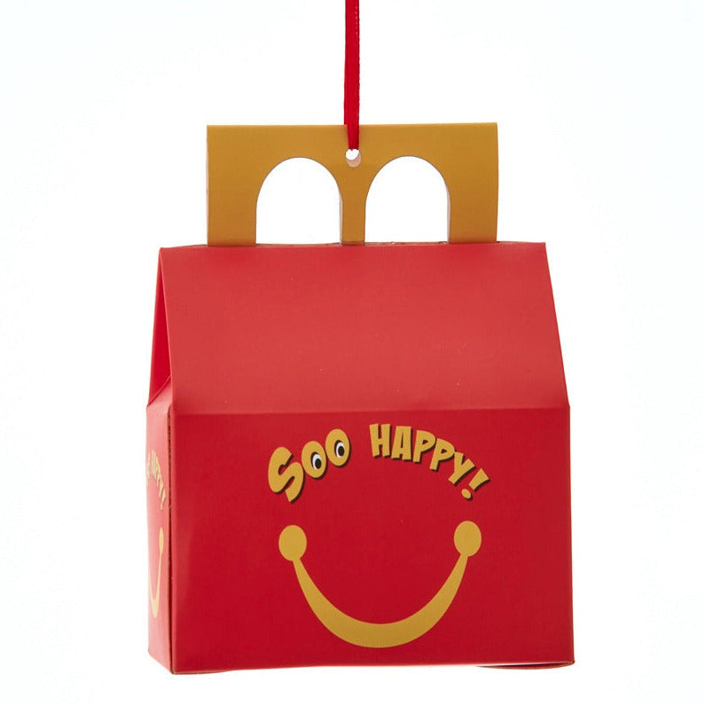 Christmas Cheer All Year Red Happy Meal box with yellow smiley face and 'Soo Happy!' text on a white background