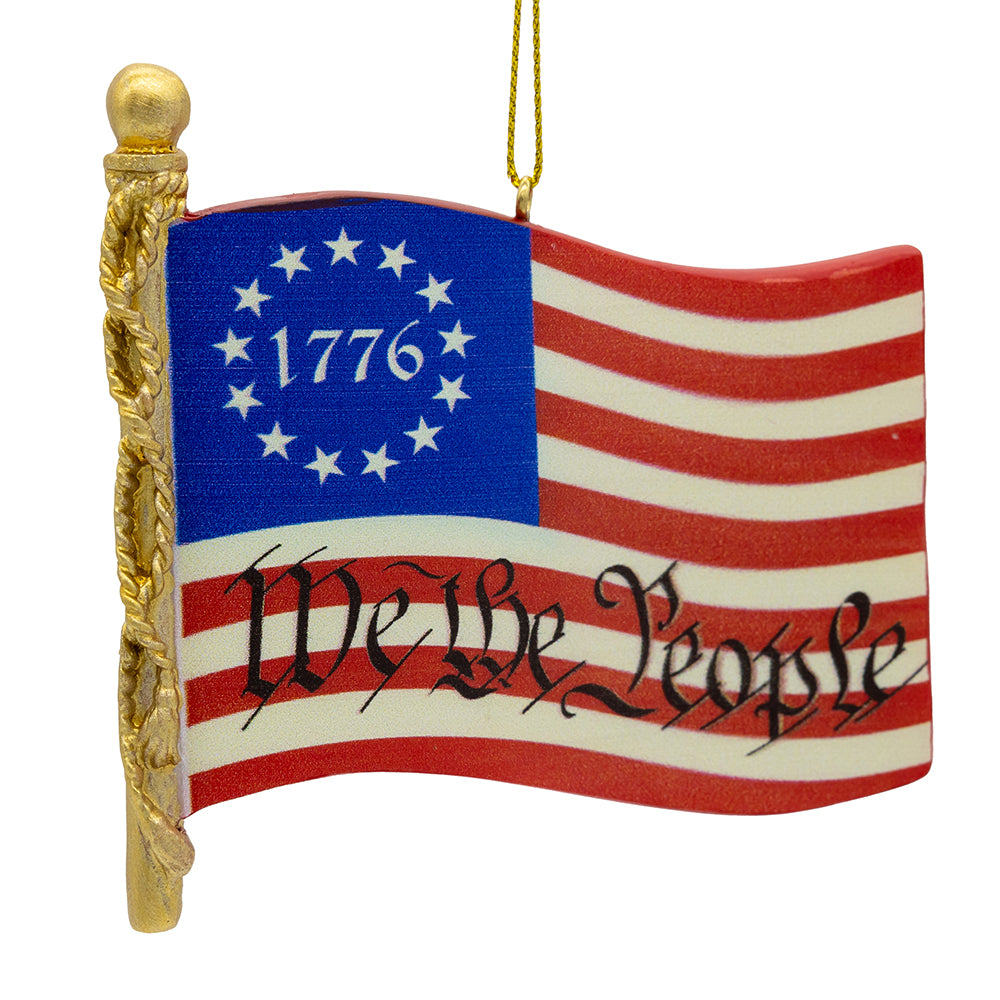 Christmas Cheer All Year Kurt Adler Decorative ornament with American flag design featuring '1776' and 'We the People'.