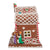 Decorative gingerbread house with three wisemen and candy decorations on a white background