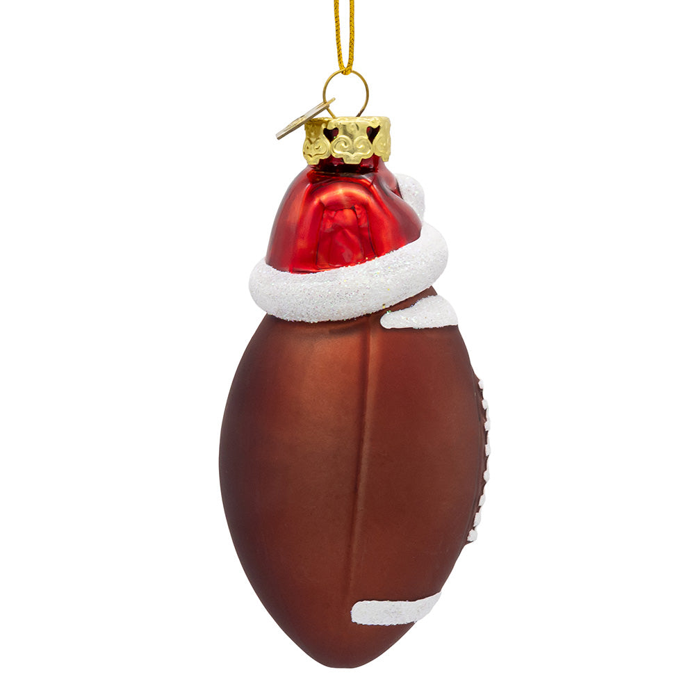 Christmas Cheer All Year Decorative football ornament with a Santa hat on a white background