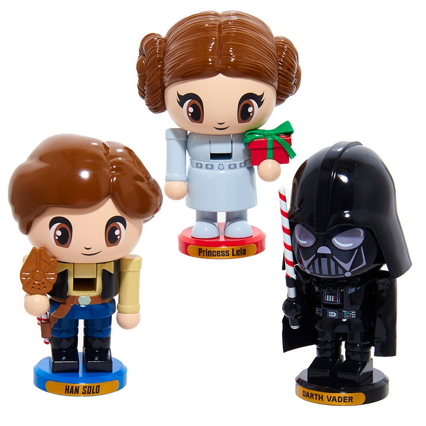 Three Star Wars-themed figurines: Han Solo, Princess Leia, and Darth Vader, on a white background.